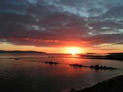 Sun setting over Galway Bay from Salthill Galway City Ireland